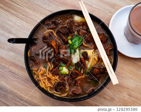 Soup with pasta and boiled beef tenderloin is traditional Chinese cuisine dish Soup with pasta and boiled beef tenderloin is traditional Chinese cuisine dish 128295380