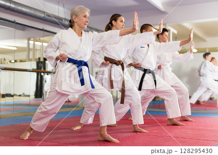 Women and men doing kata during karate training 128295430