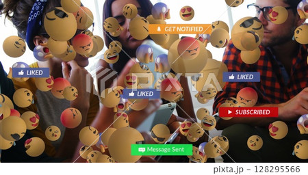 Image of social media text on banners with emojis over people using smartphone Image of social media text on banners with emojis over people using smartphone 128295566