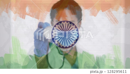 Composition of female doctor with face mask and stethoscope over indian flag 128295611