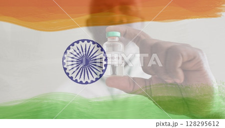 Image of male doctor holding vaccine bottle over indian flag Image of male doctor holding vaccine bottle over indian flag 128295612