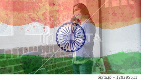 Composition of woman wearing face mask over indian flag Composition of woman wearing face mask over indian flag 128295613