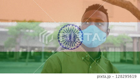 Composition of man wearing face mask over indian flag Composition of man wearing face mask over indian flag 128295619