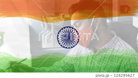 Composition of man wearing face mask over indian flag 128295627