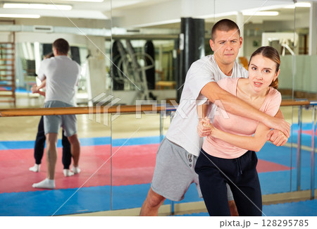 Active woman training captures on self-defense course Active woman training captures on self-defense course 128295785