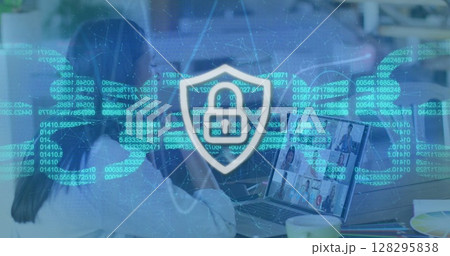Image of online security padlock and chain over people on laptop image call Image of online security padlock and chain over people on laptop image call 128295838