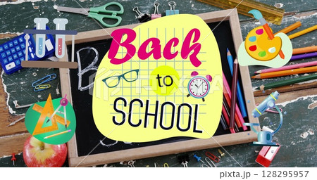 Back to school text against wooden slate and school equipment on wooden table 128295957
