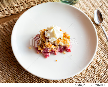 Apple crumble with cream for breakfast Apple crumble with cream for breakfast 128296014