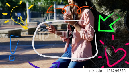 Digital icons floating against woman having a drink and using smartphone in the park 128296253