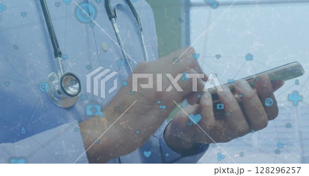 Network of digital icons against mid section of male doctor using smartphone at hospital 128296257