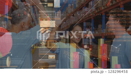 Screens with data processing against male and female volunteers high fiving each other at warehouse 128296458