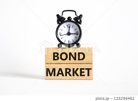 Bond Market symbol. Concept words Bond Market on wooden blocks. Beautiful white background with alarm clock. Business and Bond Market concept. Copy space. 128298462
