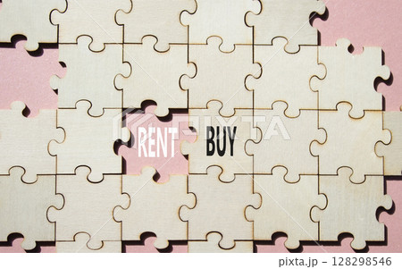 Rent or Buy symbol. Concept word Rent or Buy on wooden puzzle. Beautiful pink background. Business and Rent or Buy concept. Copy space 128298546