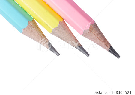 Three pastel colored pencils isolated on a white background Three pastel colored pencils isolated on a white background 128301521