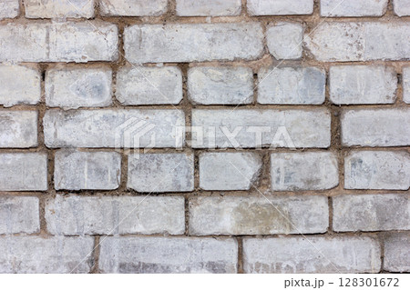 Gray brick wall texture with vintage and rustic appeal. Gray brick wall texture with vintage and rustic appeal. 128301672