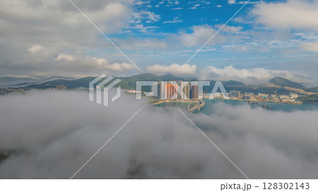 March 2 2025 Skyscrapers Emerging Through Mist in a Mountainous March 2 2025 Skyscrapers Emerging Through Mist in a Mountainous 128302143