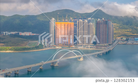 March 2 2025 Skyscrapers Emerging Through Mist in a Mountainous 128302153