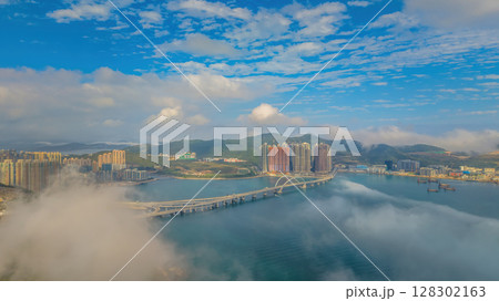 March 2 2025 Skyscrapers Emerging Through Mist in a Mountainous March 2 2025 Skyscrapers Emerging Through Mist in a Mountainous 128302163