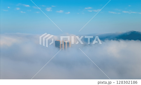 March 2 2025 Emerging From a Sea of Clouds Against a Blue Sky 128302186