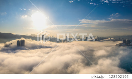 March 2 2025 Urban Skyline Emerging Through Clouds During sunset March 2 2025 Urban Skyline Emerging Through Clouds During sunset 128302195