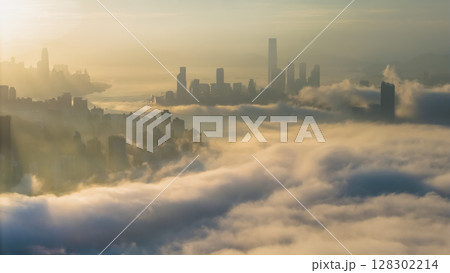 March 2 2025 Captivating Urban Skyline Shrouded in Morning Mist During Sunset 128302214