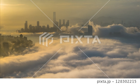 March 2 2025 Captivating Urban Skyline Shrouded in Morning Mist During Sunset 128302215