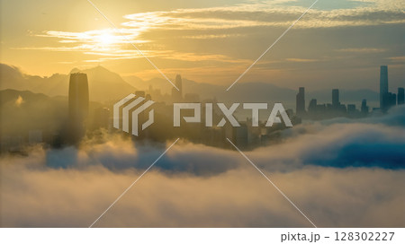 March 2 2025 Captivating Urban Skyline Shrouded in Morning Mist During Sunset 128302227