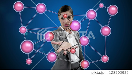 Interacting with virtual network, businesswoman exploring digital connections in office 128303923