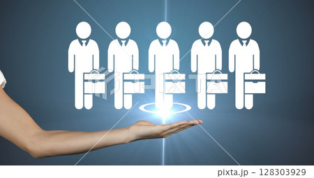 Hand holding digital icons of businesspeople, symbolizing teamwork and leadership 128303929