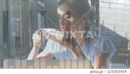 Image of statistics and data processing over woman drinking coffee and using laptop Image of statistics and data processing over woman drinking coffee and using laptop 128303954
