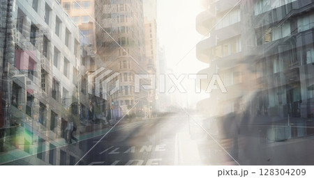 Image of busy city street with pedestrians walking in fast pace Image of busy city street with pedestrians walking in fast pace 128304209