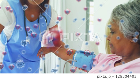In school, virus cells floating while health worker checking blood pressure of woman In school, virus cells floating while health worker checking blood pressure of woman 128304403