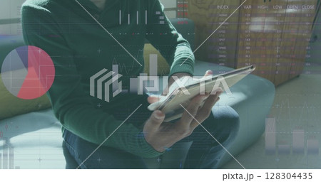 Statistical data processing against man using digital tablet at office 128304435
