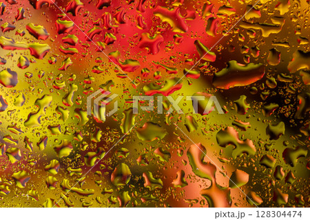 abstract background fall, glass drops autumn yellow leaves wet october weather 128304474