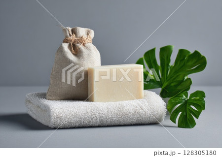 spa composition with natural soap and an empty tag on a grey background 128305180