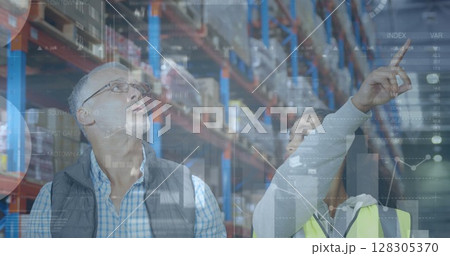 Image of statistics financial data processing over man and woman working in warehouse Image of statistics financial data processing over man and woman working in warehouse 128305370