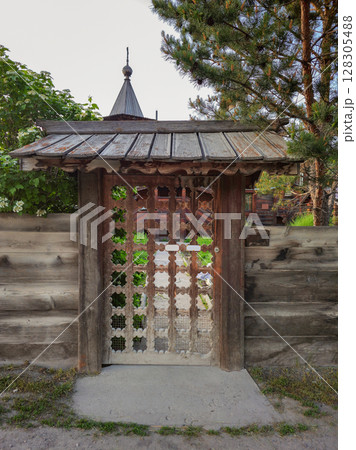 old carved wooden gate in old wooden church old carved wooden gate in old wooden church 128305488