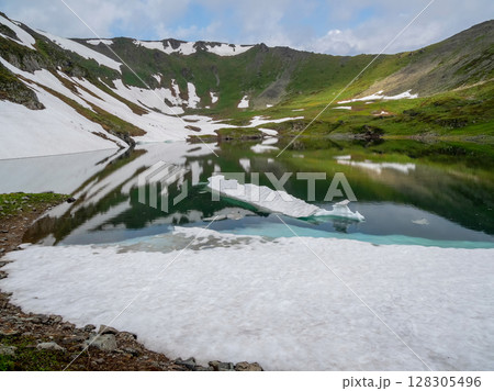 Picturesque mountain landscape with a lake Picturesque mountain landscape with a lake 128305496