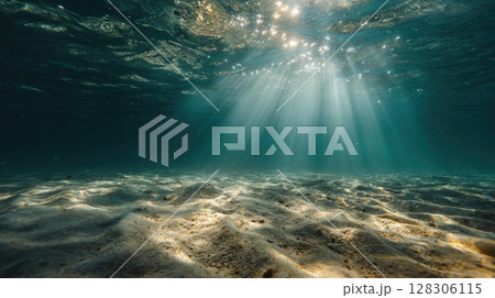 serene underwater scene with the sun's rays piercing through the ocean surface 128306115