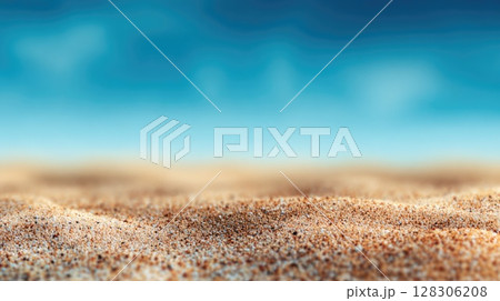 Beautiful summer background with sand and blue sky. Blurred beach scene with copy space 128306208