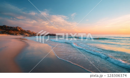 Beautiful beach sunset with a calm sea and sky Beautiful beach sunset with a calm sea and sky 128306374