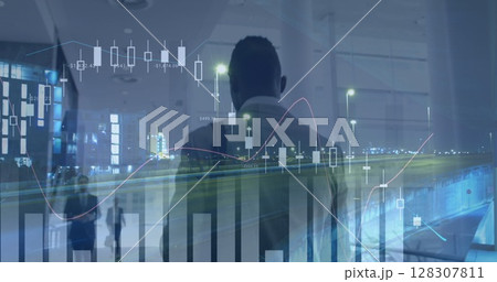 Image of financial data processing over businessman working in office 128307811