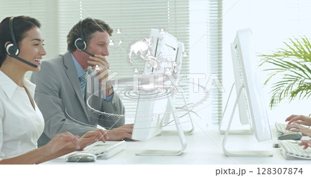 Image of network of connections over happy diverse office workers wearing headsets Image of network of connections over happy diverse office workers wearing headsets 128307874