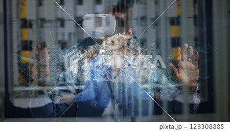 Digital composite of businessman using VR, touching screen and having a digital cloud image appear, 128308885