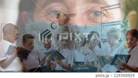Image of Caucasian woman in mask for protection over teacher and students in class Image of Caucasian woman in mask for protection over teacher and students in class 128308929