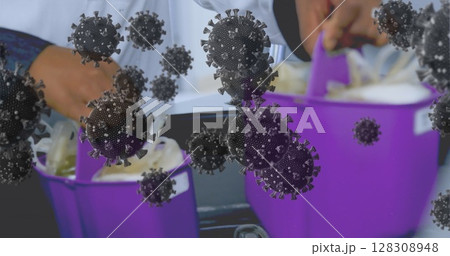 Hands cleaning with purple buckets and floating virus illustrations in foreground Hands cleaning with purple buckets and floating virus illustrations in foreground 128308948