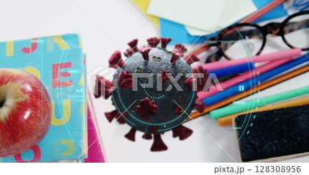 Image of Covid 19 coronavirus cell spinning, scope scanning over desk with school items Image of Covid 19 coronavirus cell spinning, scope scanning over desk with school items 128308956