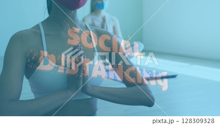 Image of multiple words flashing over caucasian women wearing face mask meditating Image of multiple words flashing over caucasian women wearing face mask meditating 128309328