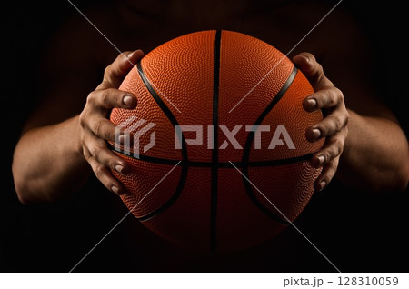 Basketball ball in male hands Basketball ball in male hands 128310059