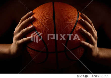 Basketball ball in male hands 128310062